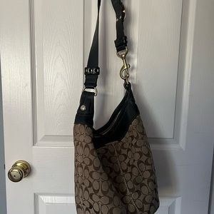 In good shape Coach oversize bag in notebook fits inside.